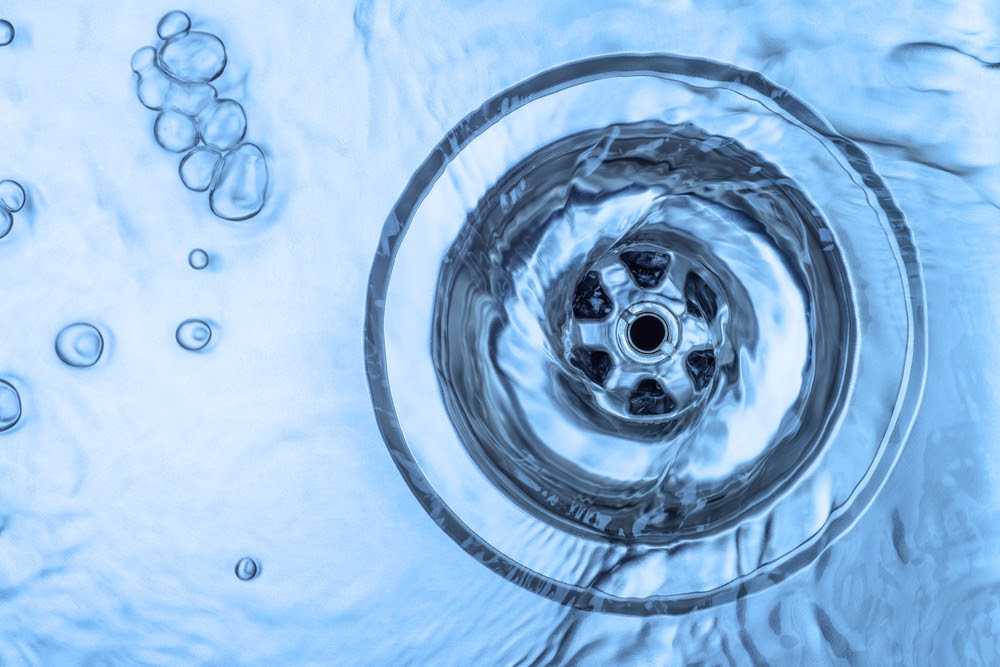 Water swirling down a unclogged drain